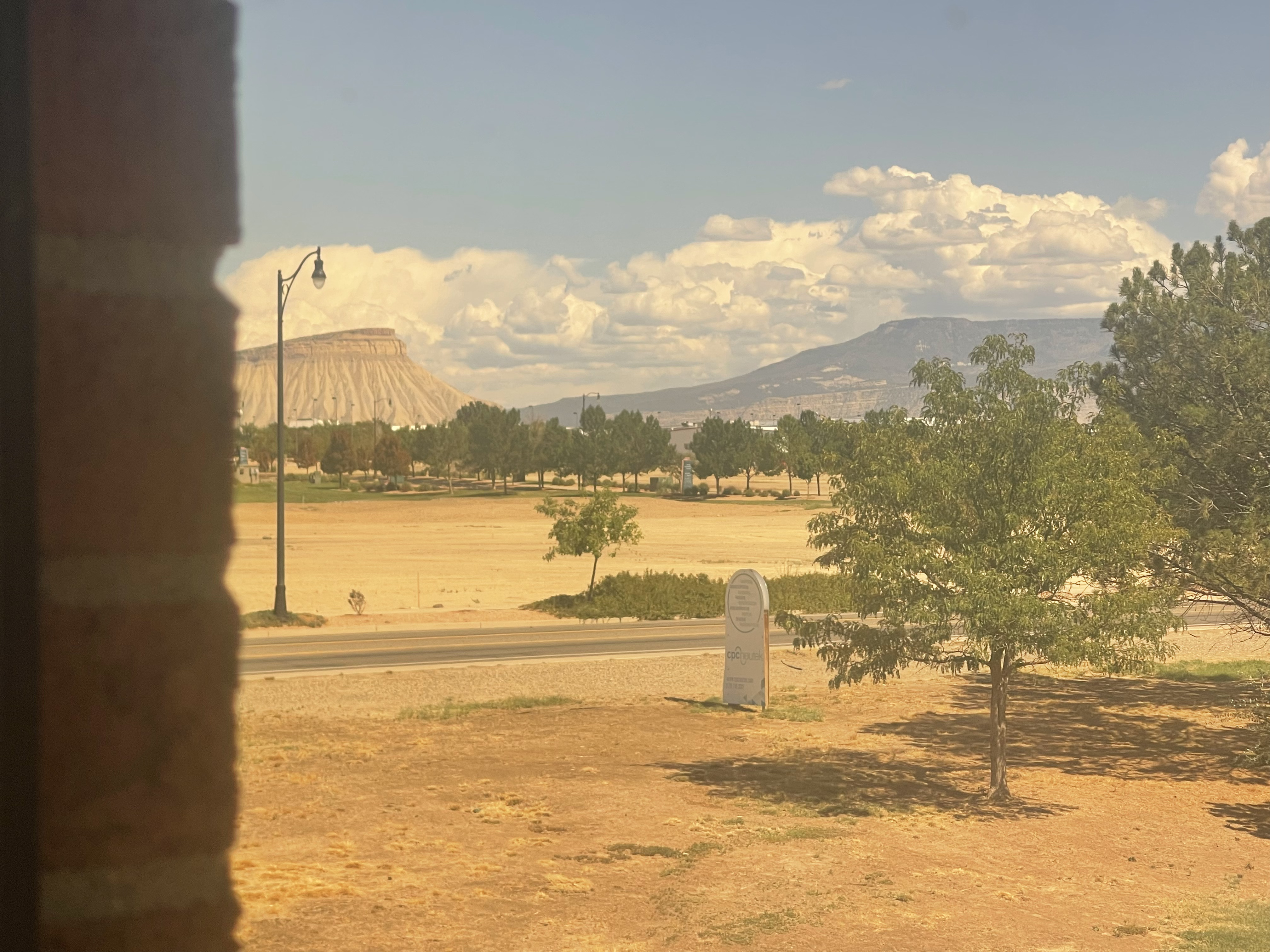 View from Suite 201 of the cpc neutek sign, Mount Garfield and the Grand Mesa